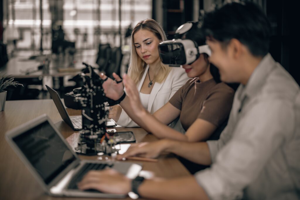 College students aid research, using VR goggles for immersive learning with educational robots.